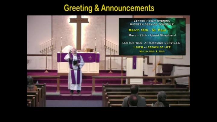 A pastor standing center frame with the text Greetings above written in yellow. 