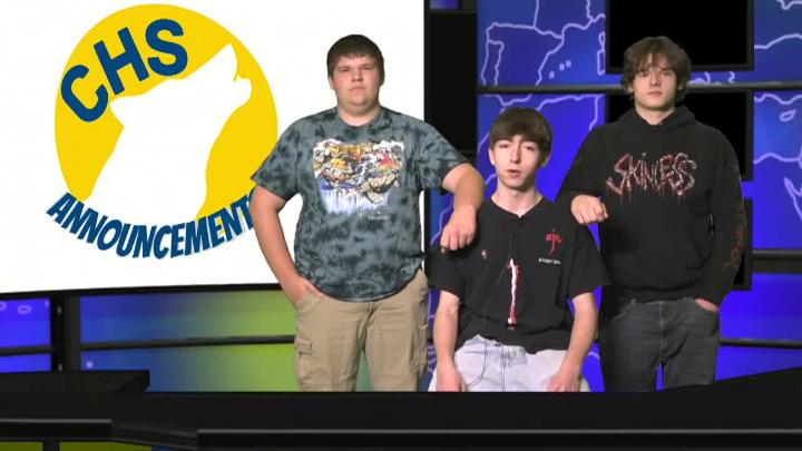 Three students stand at a virtual news desk with CHS Announcements projected behind them with a silhouette of a wolf in the middle. 