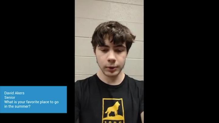 A vertical video of a student with text to the left of frame in a blue box. 